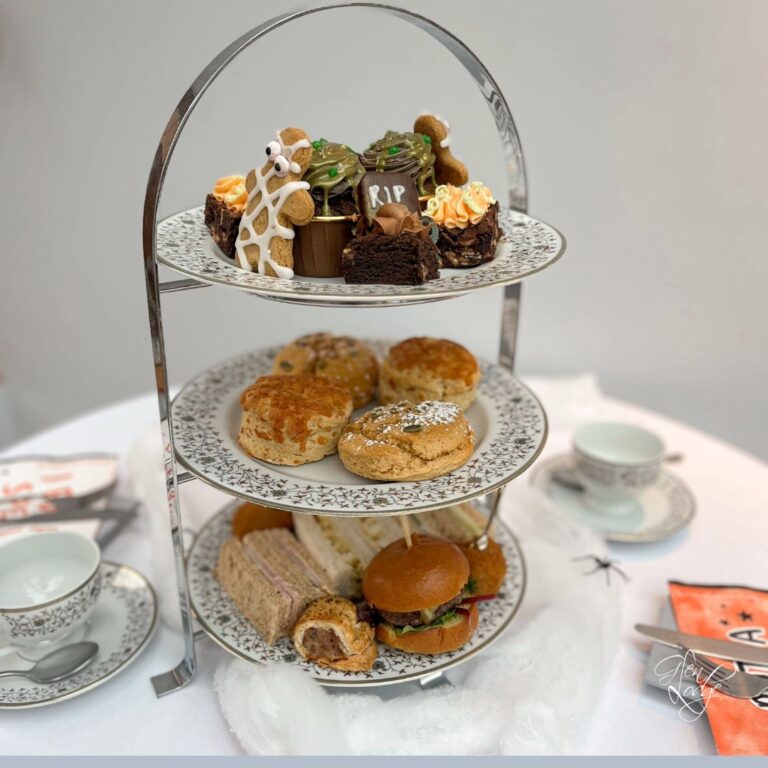 alloween afternoon tea stand at Glen Lodge with pumpkin cakes, autumn scones and themed treats overlooking Bawburgh Golf Club