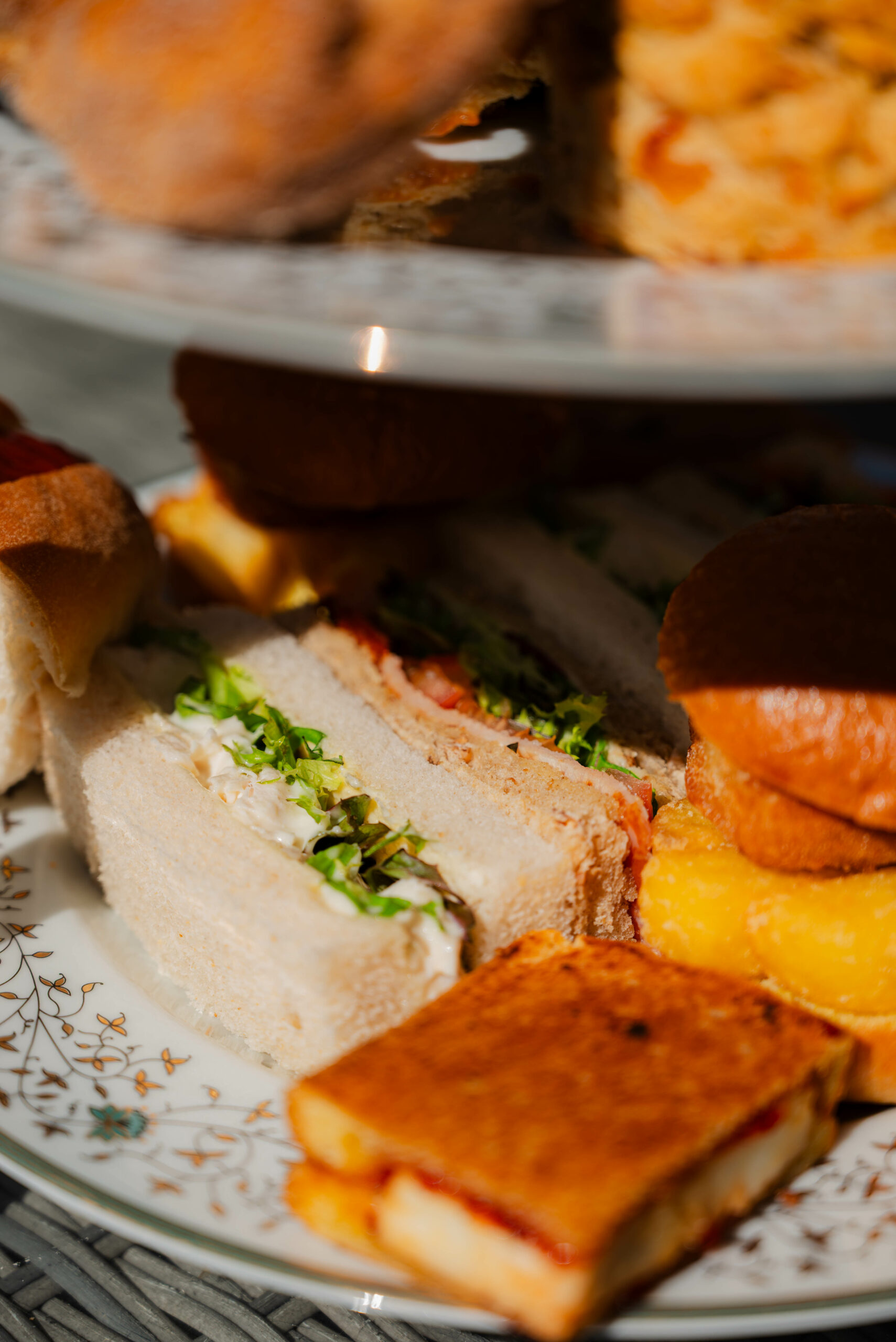Afternoon Tea near Norwich — classic sandwiches, scones and cakes at Glen Lodge with views across the golf course.