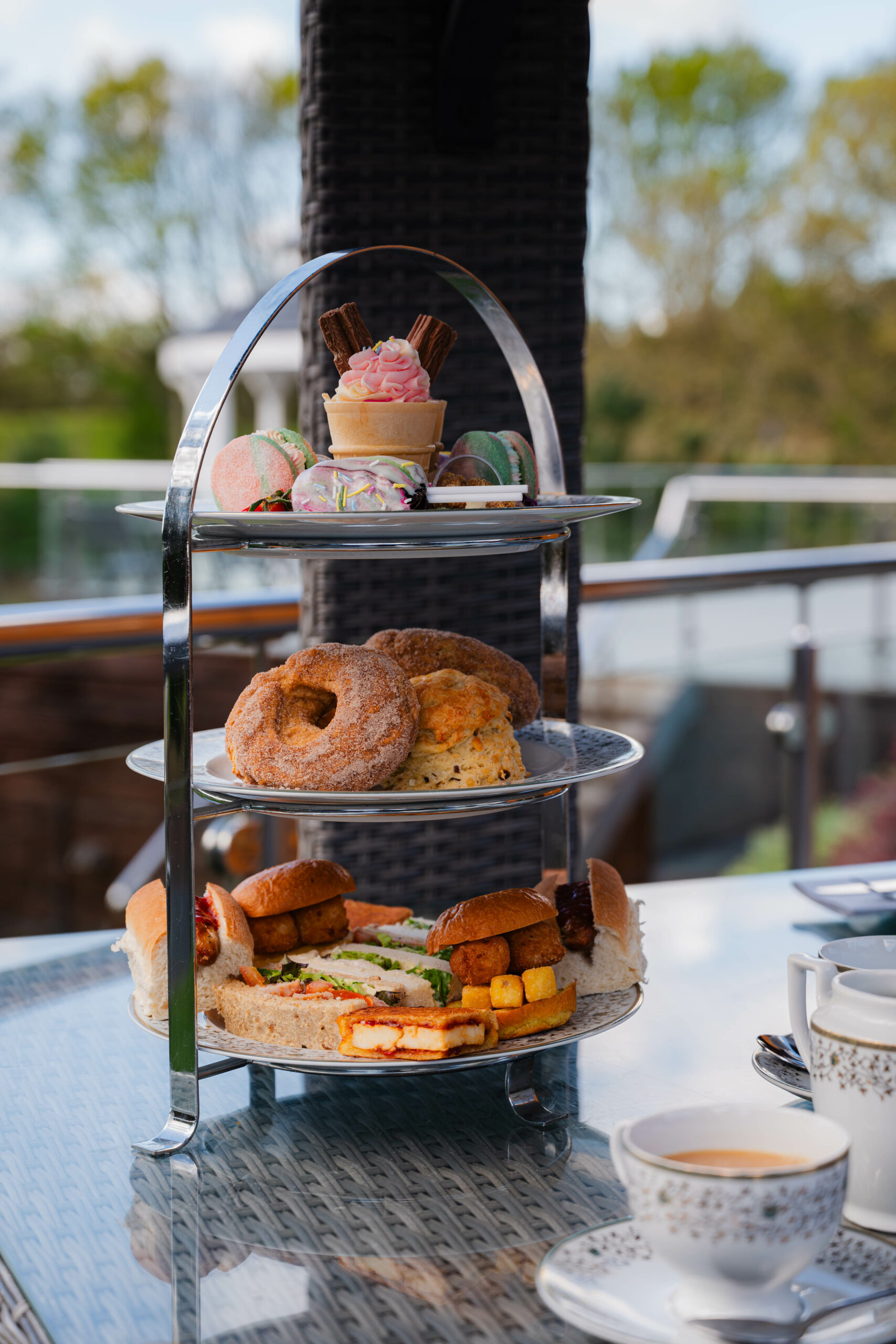 Afternoon Tea near Norwich — classic sandwiches, scones and cakes at Glen Lodge with views across the golf course.